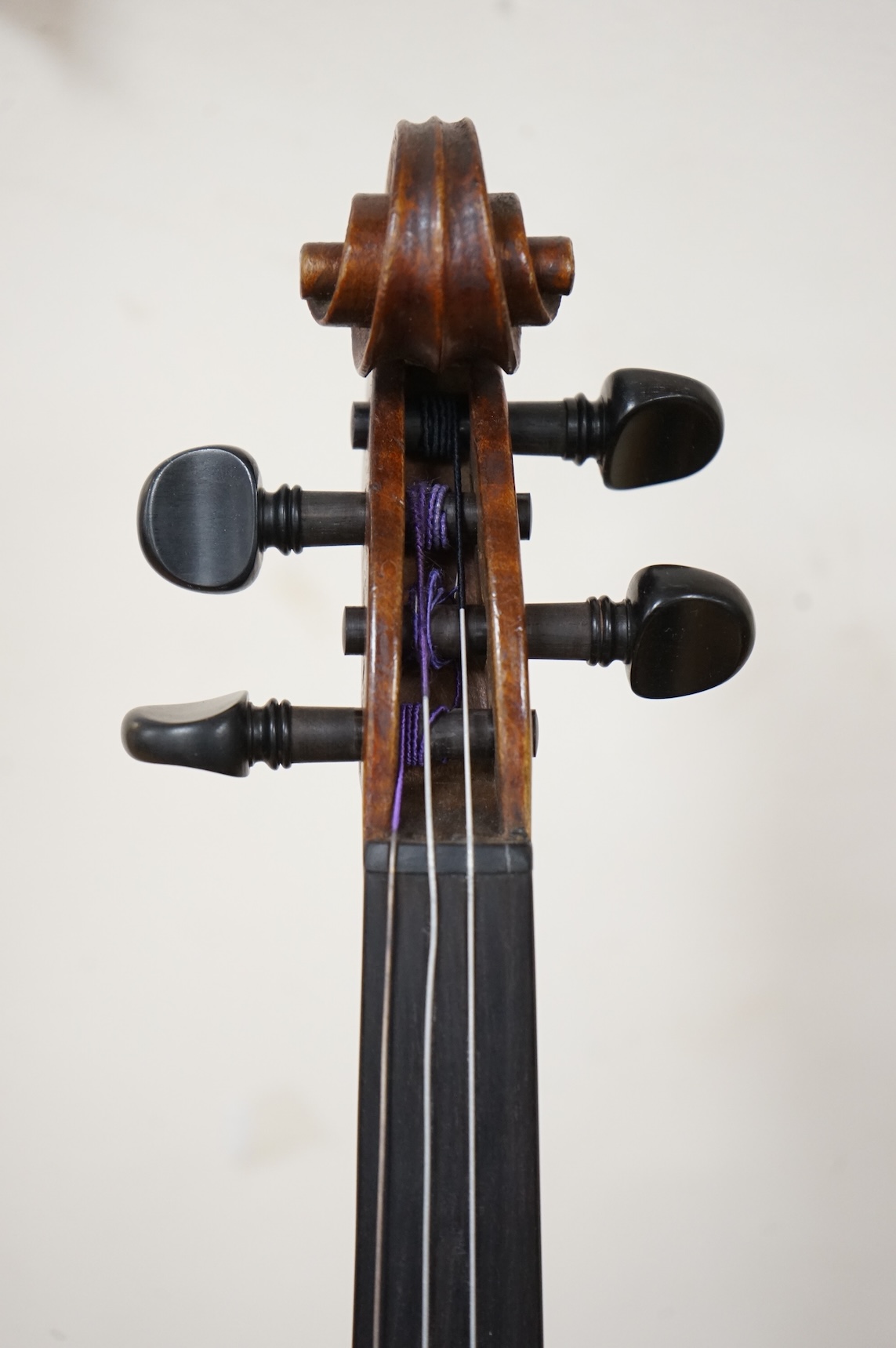 A cased late 19th century violin, signed ‘Nicolas Bertolini’, back 36.3cm, with bow stamped Paesold, CITES Submission reference, D9GSYMLJ